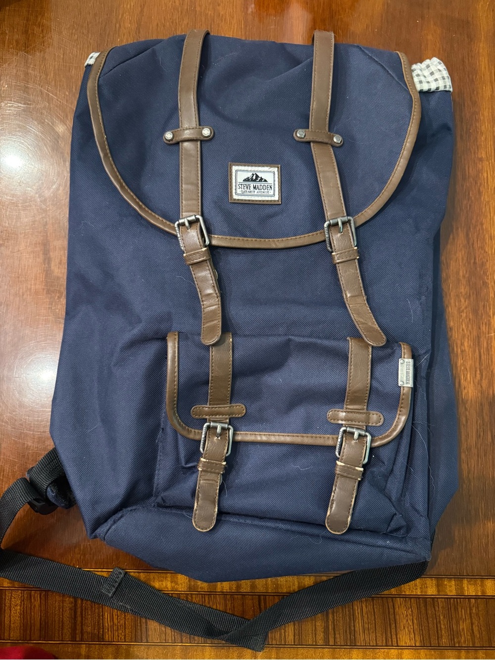 Steve Madden Navy Backpack with Brown Trim and Buckle Accents